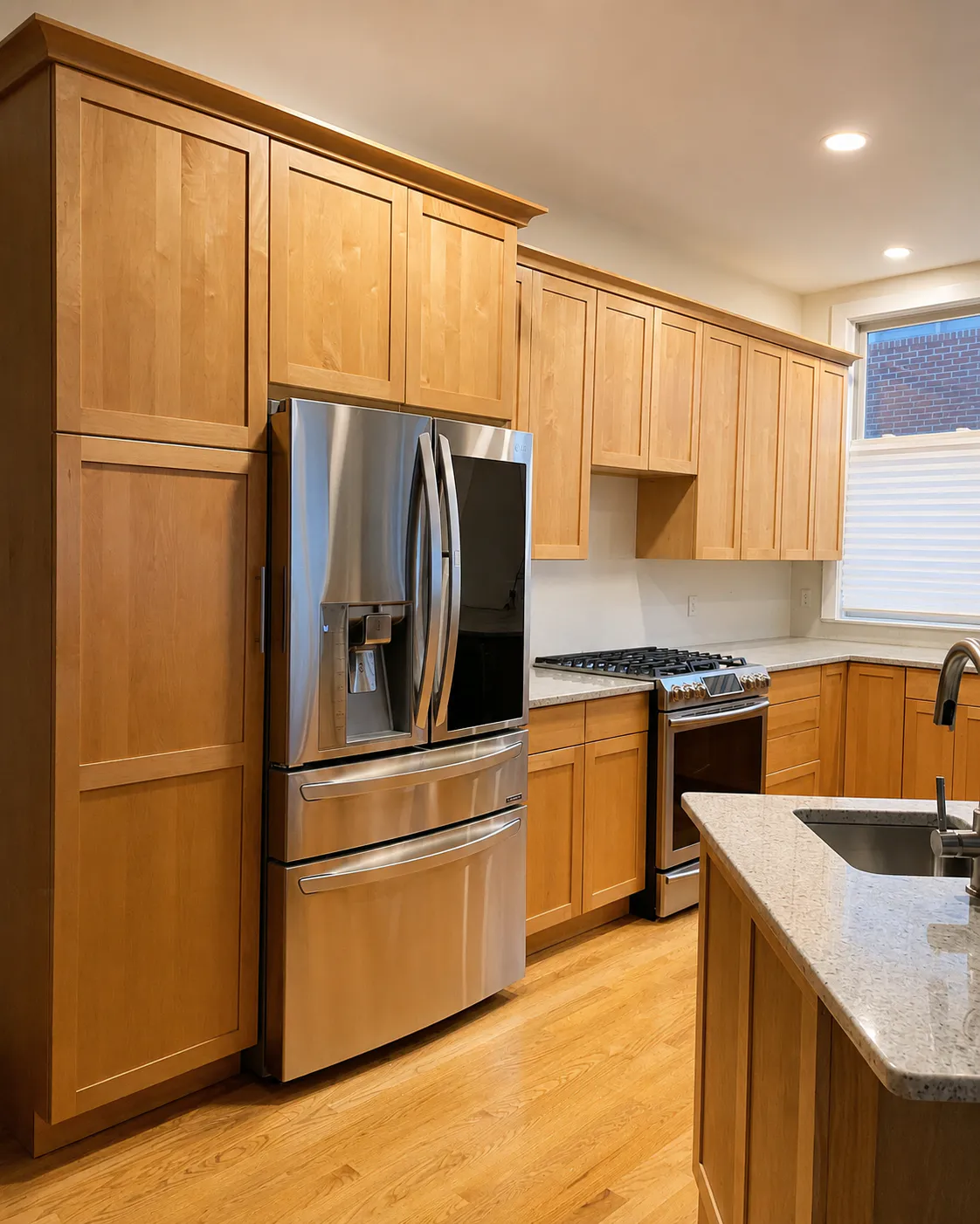 Before - kitchen with warm wood-tone cabinets